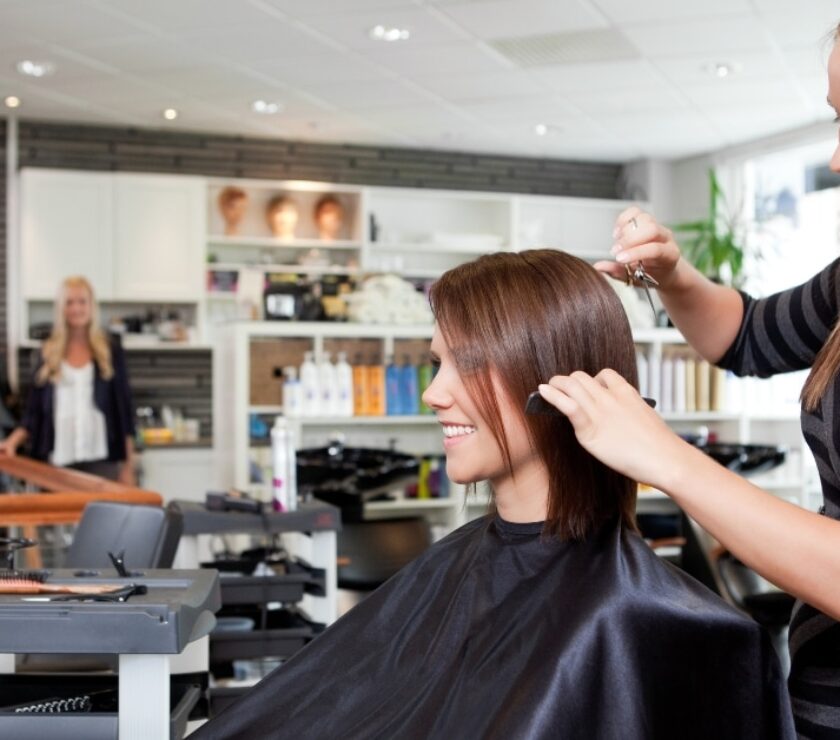 Close-up of professional hair cutting scissors on a salon workstation