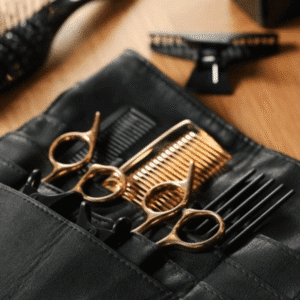 Flat lay of professional salon tools including thinning shears and combs