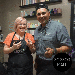 Team of professional hairstylists posing inside a modern salon